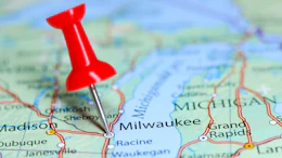Red pushpin marking Milwaukee on a road map of Wisconsin and surrounding states