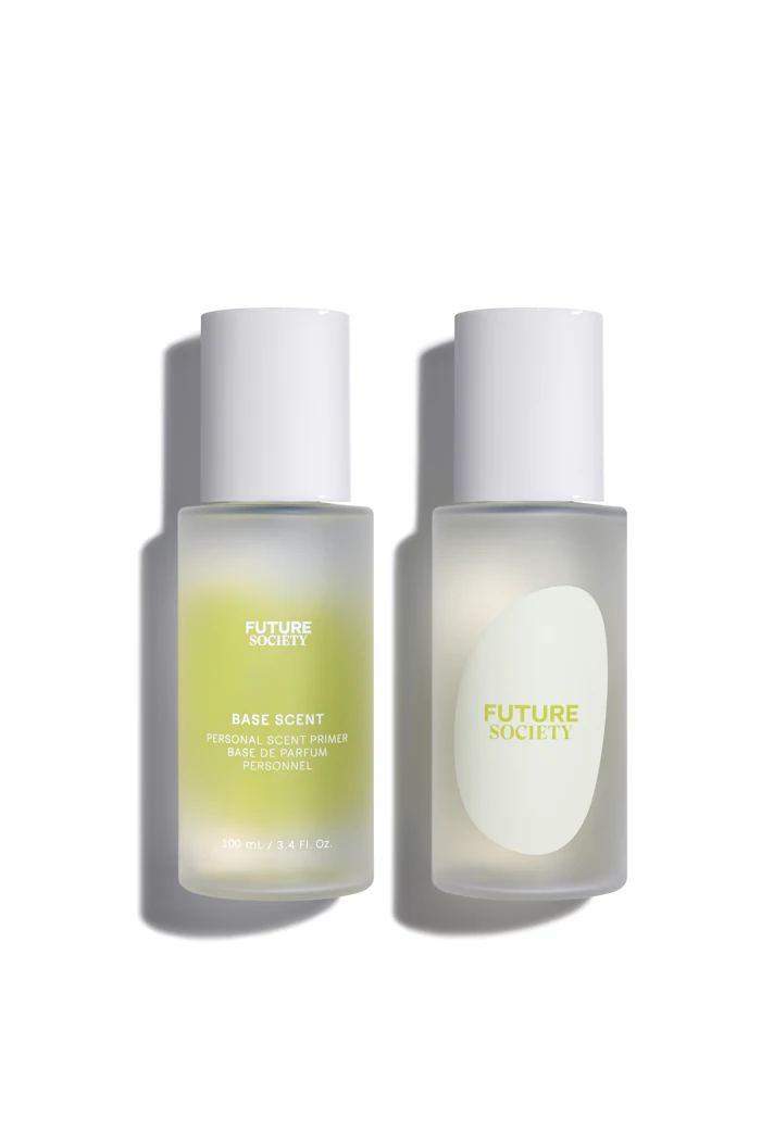 Two frosted glass bottles of Future Society Base Scent personal scent primer with white caps displayed against a white background